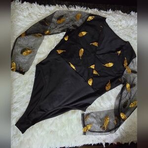 Black shirt with gold applique